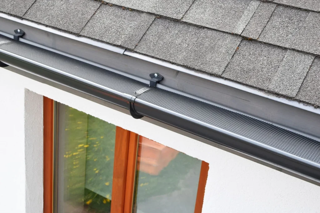 new black gutter installed on residential home